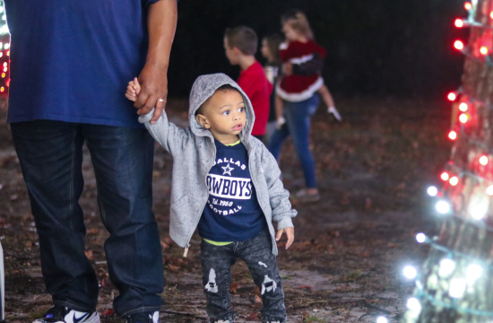 Child looking at Holiday Lights