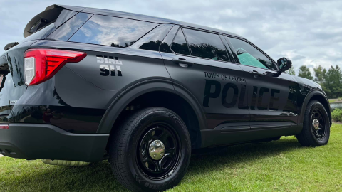 Town of Leland black police vehicle