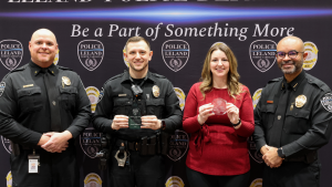 Police award recipients posing for photo with awards