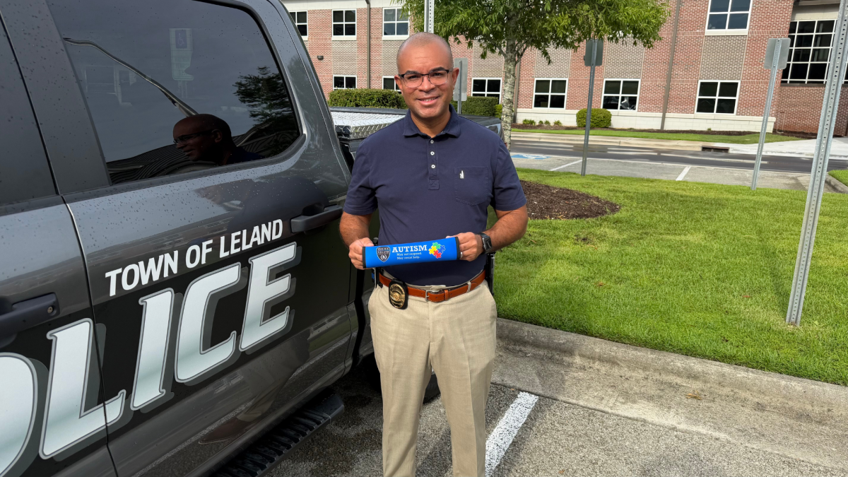 Police chief holding seatbelt cover