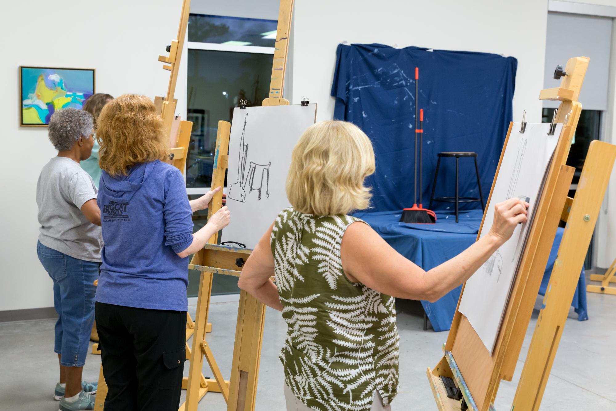 Adults in an acrylic painting class
