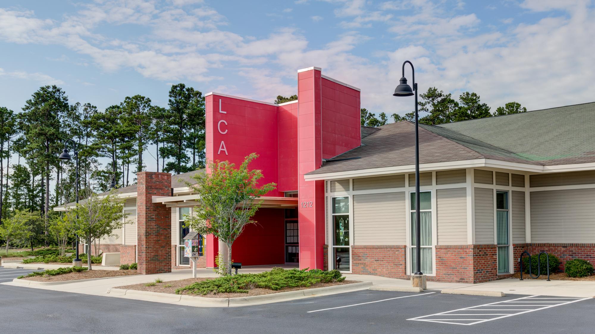 Brick building with bright red exterior in Leland, NC