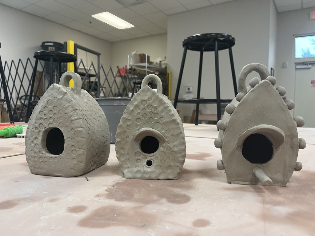 Image of bird houses made out of clay