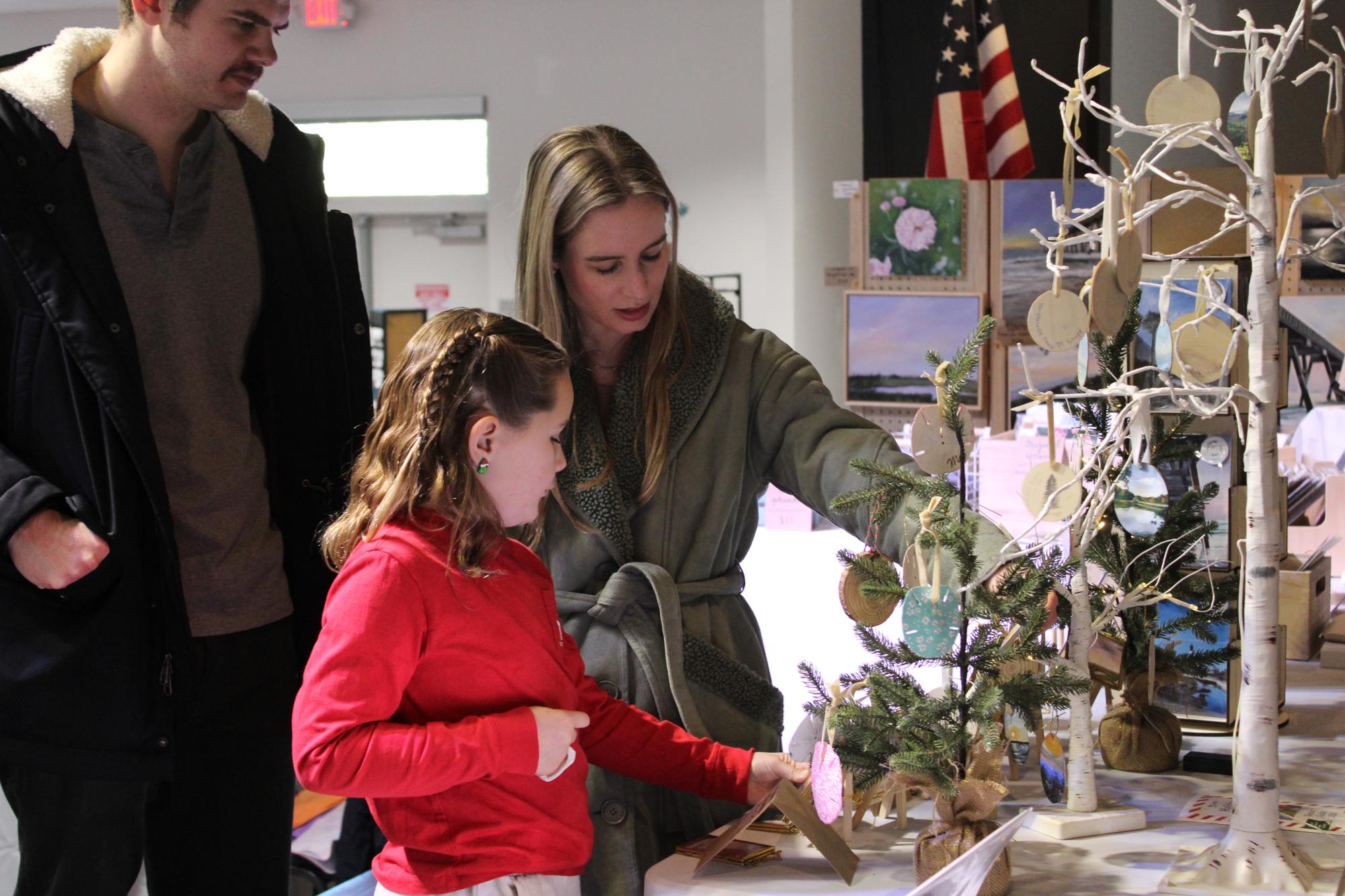 Family looking at vendor displays
