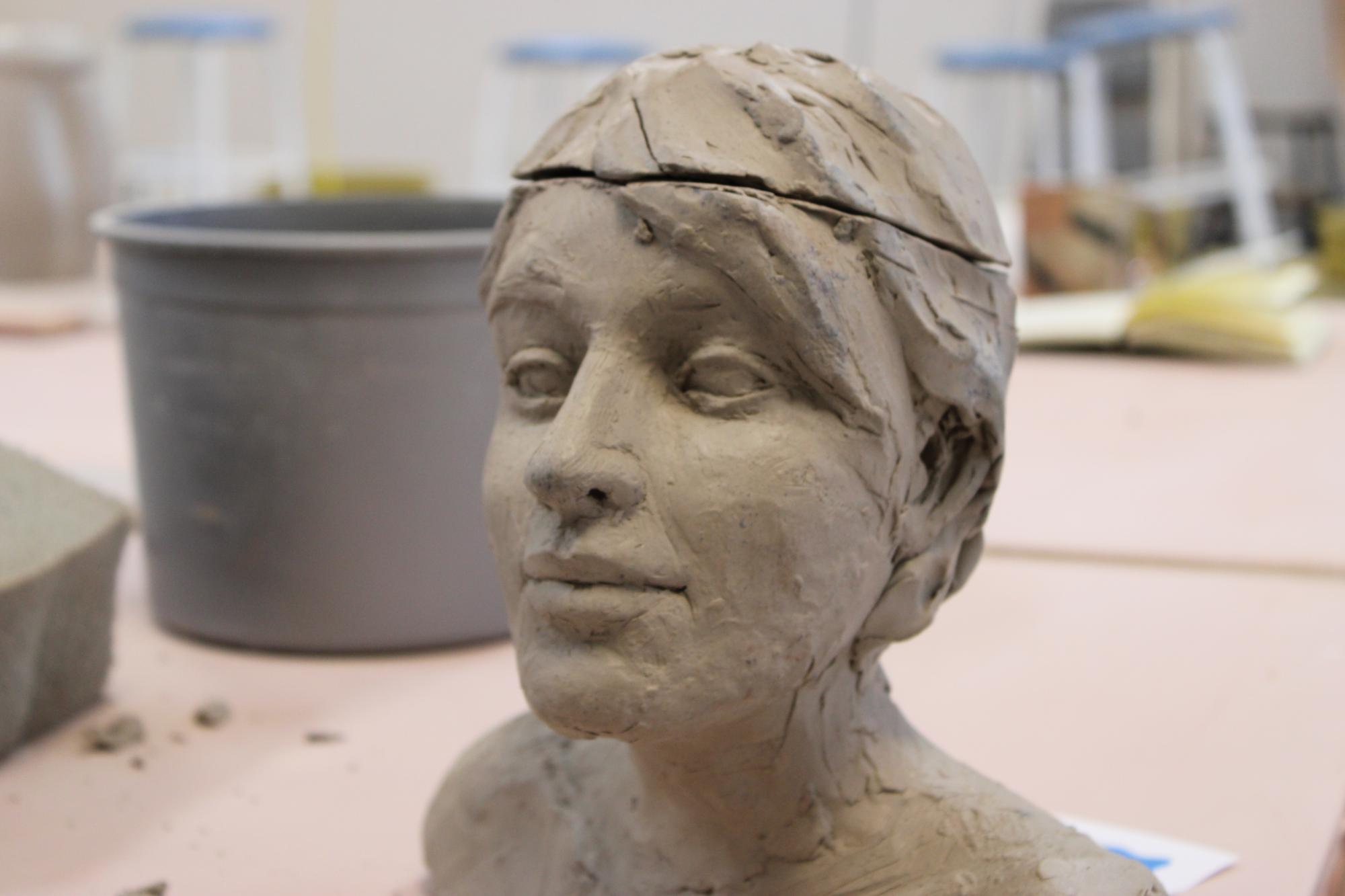 A clay bust of a woman