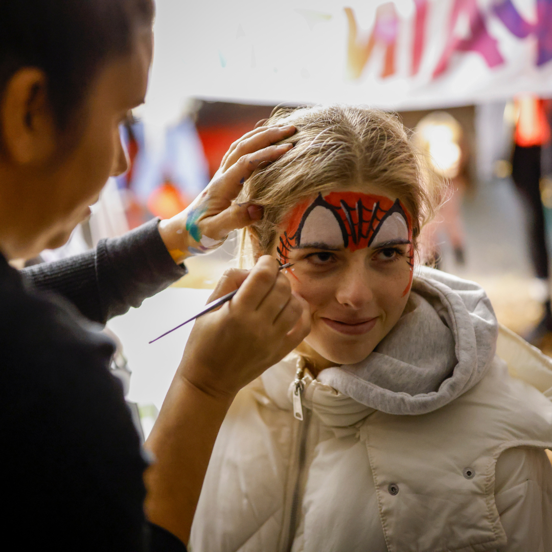 kid getting face painted
